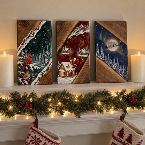All three designs on a Christmas mantel - Cardinals, Santa's Cottage and Sleigh and Moon - between two candles